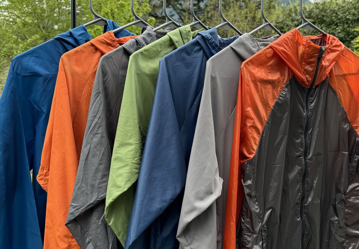 a collection of ultraligt windshell jackets on a garment rack