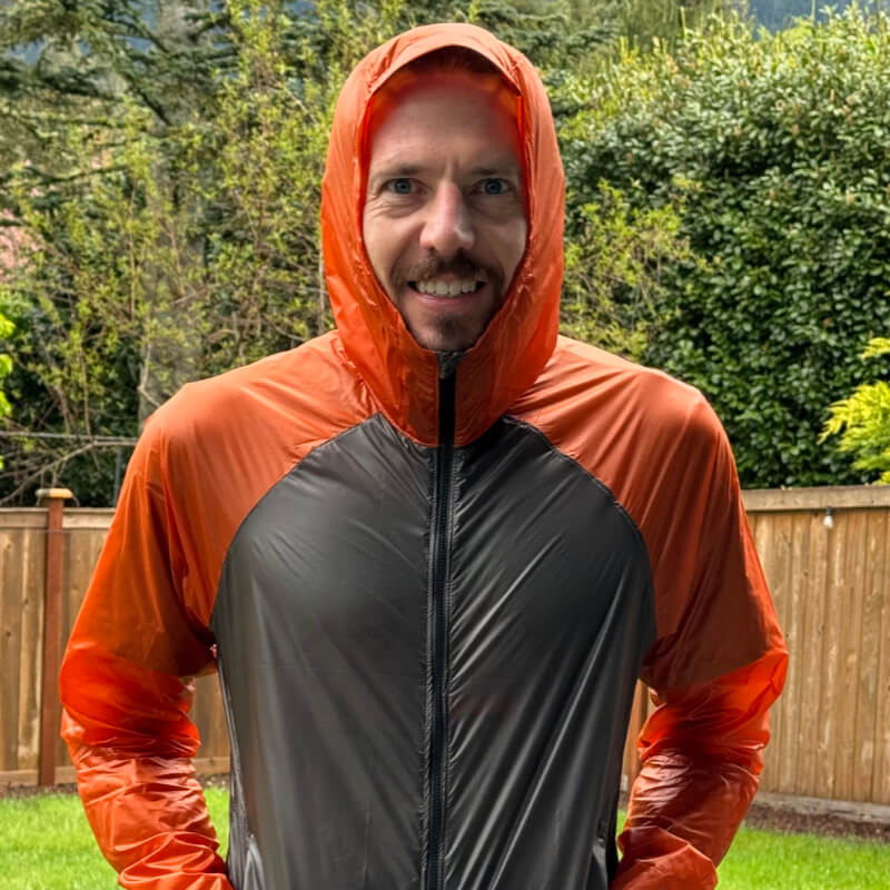 Hiker wearing an ultralight breathable shell jacket